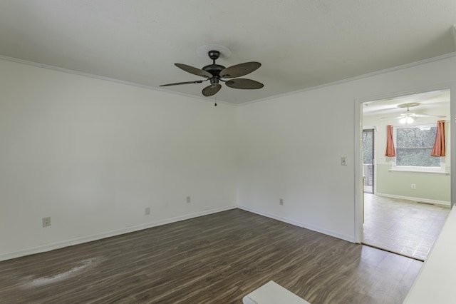 empty room with crown molding, dark wood-type flooring, and ceiling fan