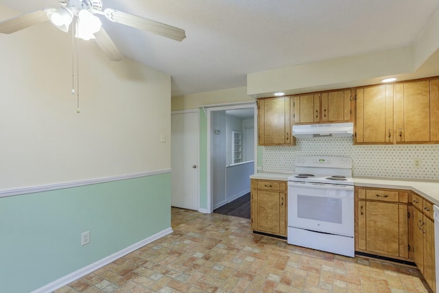 kitchen featuring ceiling fan, backsplash, and white appliances