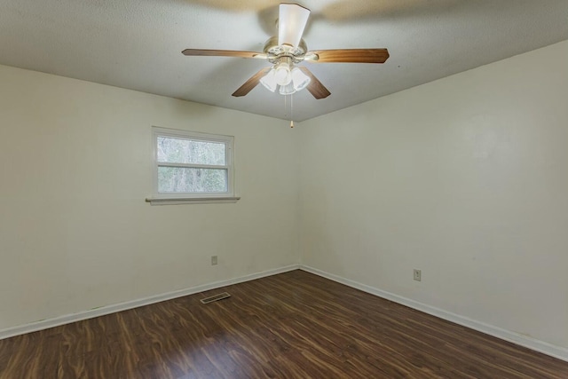 unfurnished room featuring dark hardwood / wood-style flooring, a textured ceiling, and ceiling fan