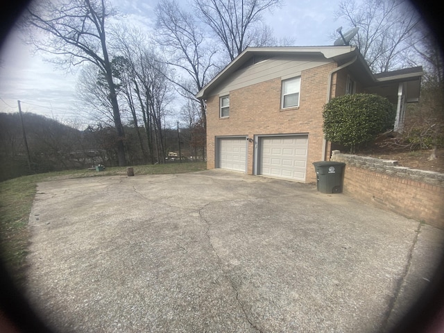 view of side of property with a garage