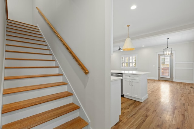 stairway with hardwood / wood-style flooring