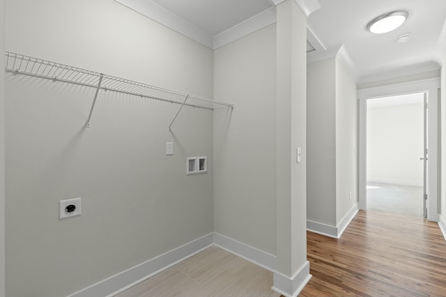 washroom with hookup for a washing machine, light wood-style floors, electric dryer hookup, and baseboards