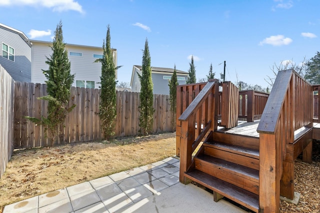 exterior space featuring a fenced backyard and a patio