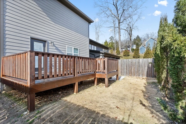 wooden terrace featuring fence