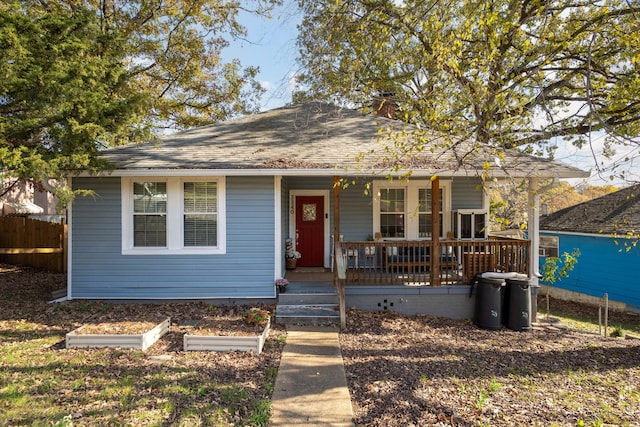 bungalow-style house featuring french doors and covered porch