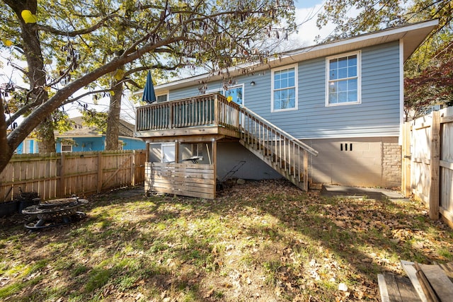 rear view of property with a wooden deck