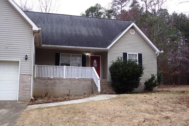 view of front of house featuring a front yard and covered porch