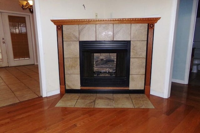 room details with hardwood / wood-style floors and a fireplace