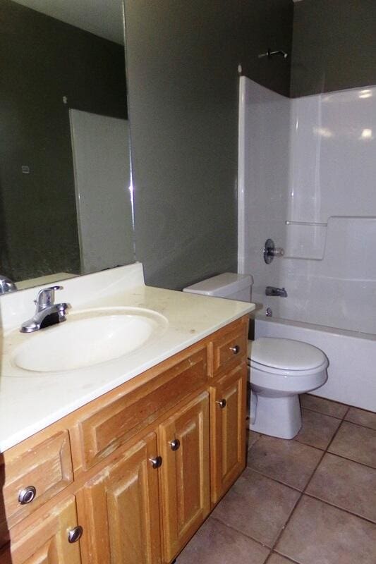 full bathroom featuring shower / tub combination, tile patterned floors, toilet, and vanity