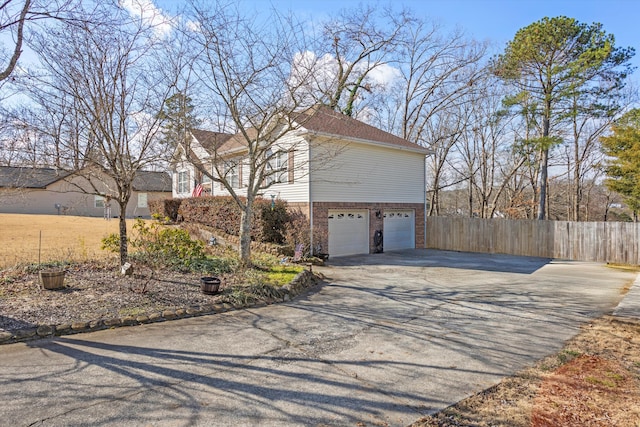 view of property exterior with a garage