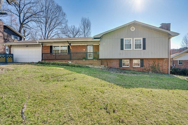 view of front facade featuring brick siding, a porch, a front yard, a chimney, and an attached garage