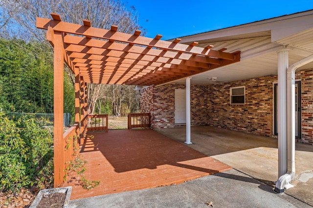 view of patio featuring a pergola and a deck