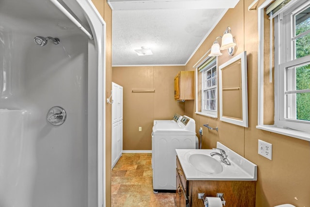 bathroom featuring vanity, a textured ceiling, ornamental molding, and toilet