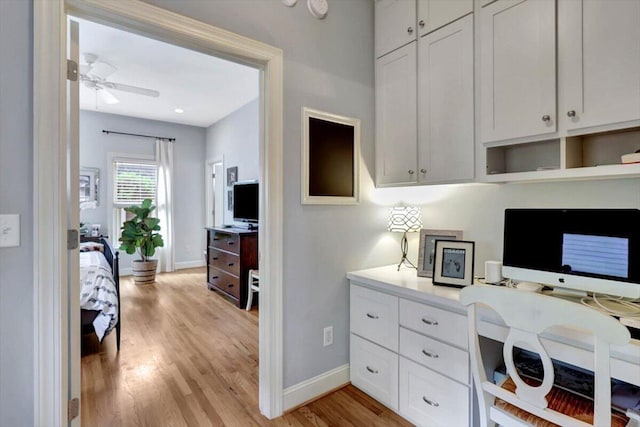 home office featuring ceiling fan and light wood-type flooring