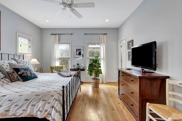 bedroom featuring multiple windows and light wood-type flooring