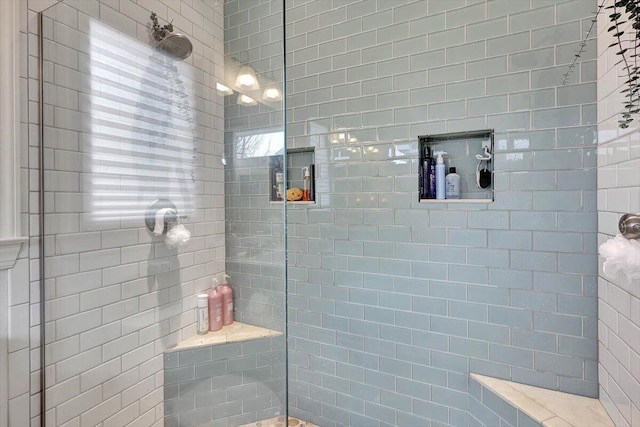 bathroom with tiled shower