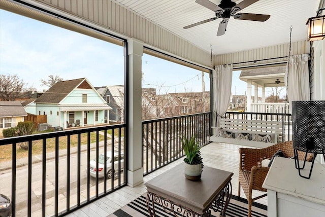 exterior space featuring a porch and ceiling fan