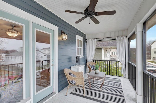 sunroom featuring ceiling fan