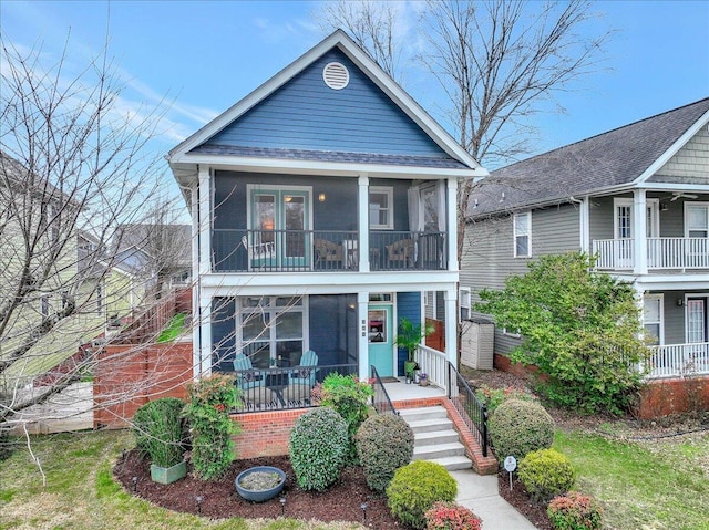 view of front of home with a sunroom