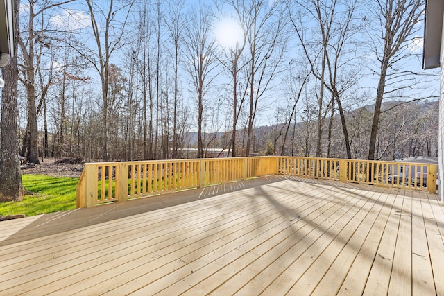 wooden terrace with a forest view