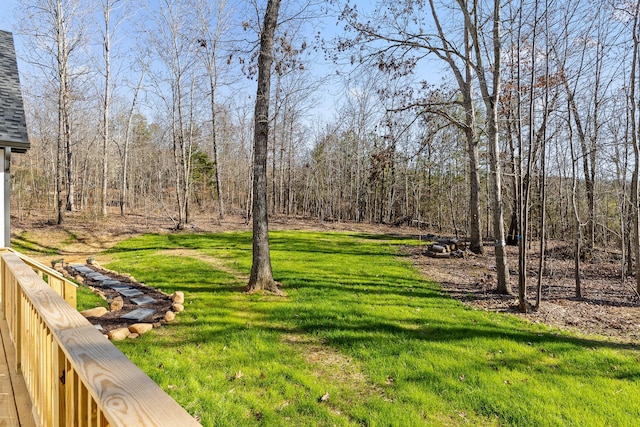 view of yard featuring a forest view