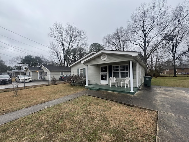 view of front of property with covered porch and a front lawn