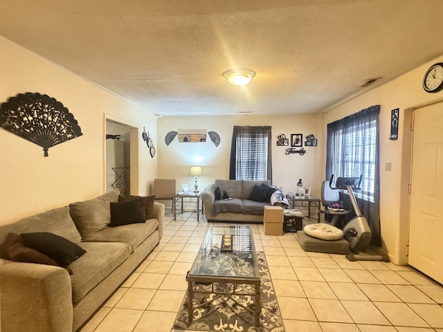 living room with light tile patterned floors and a textured ceiling