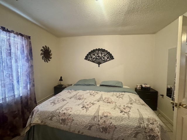 bedroom featuring a textured ceiling