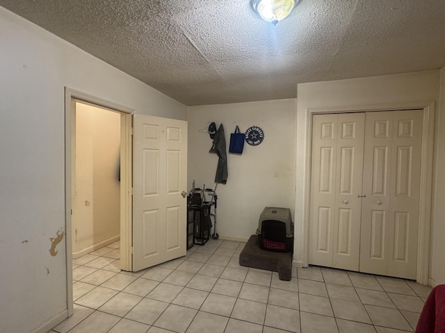 interior space featuring a textured ceiling