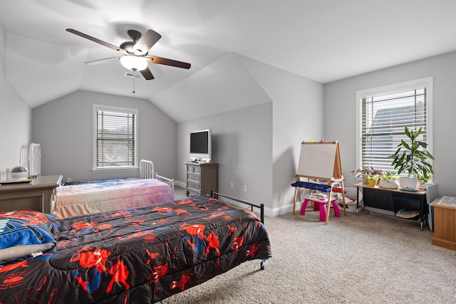 carpeted bedroom with ceiling fan and vaulted ceiling