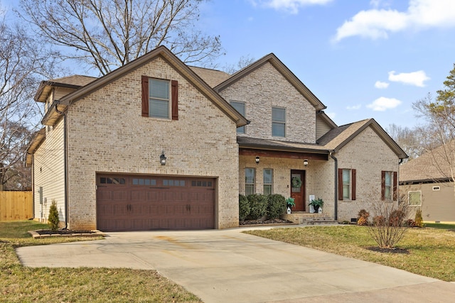 view of property featuring a garage and a front yard