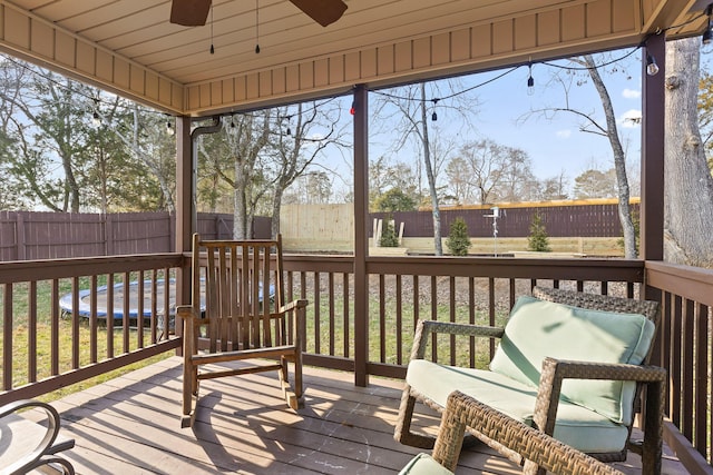 sunroom with ceiling fan and a wealth of natural light