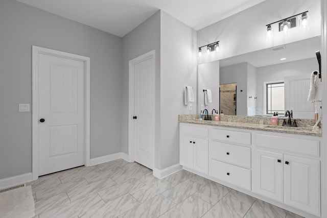 bathroom featuring vanity and a shower