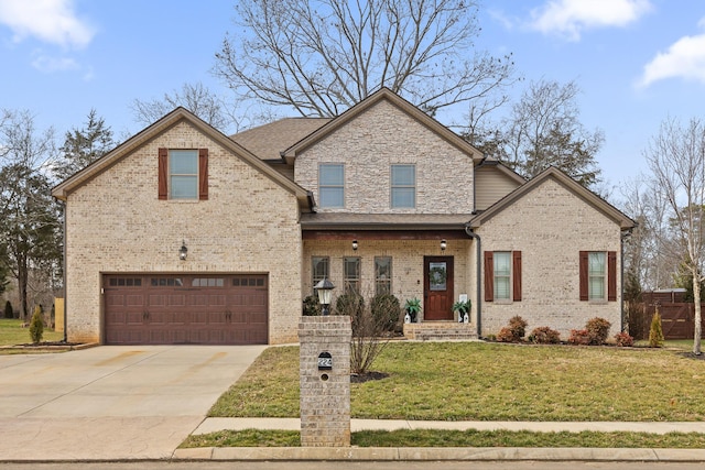 view of front of property with a garage and a front yard