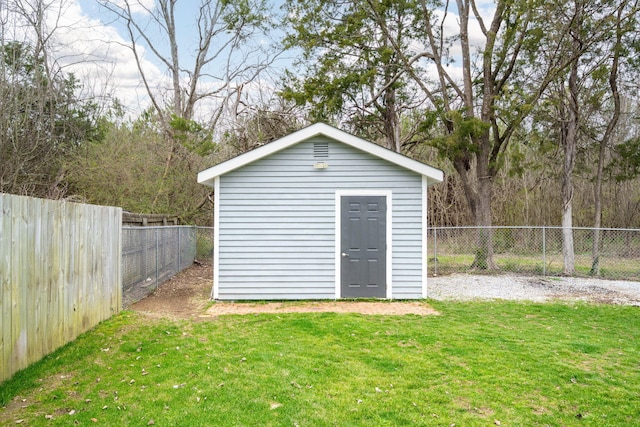 view of outbuilding with a lawn