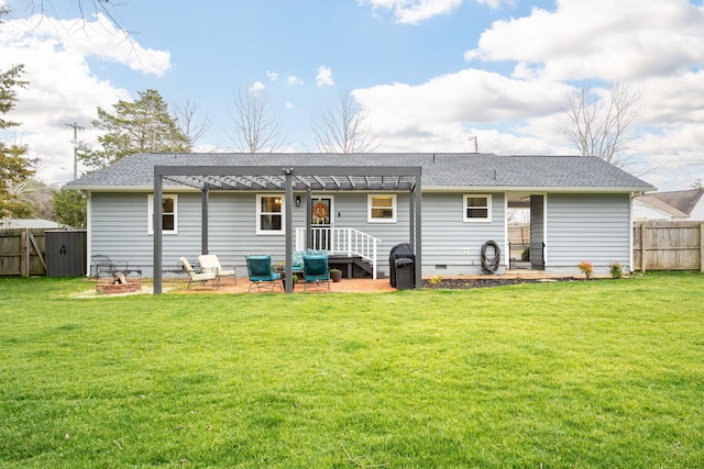 back of house with a pergola, a patio, and a lawn