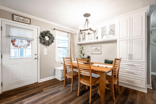 dining area featuring a notable chandelier, crown molding, and dark hardwood / wood-style floors