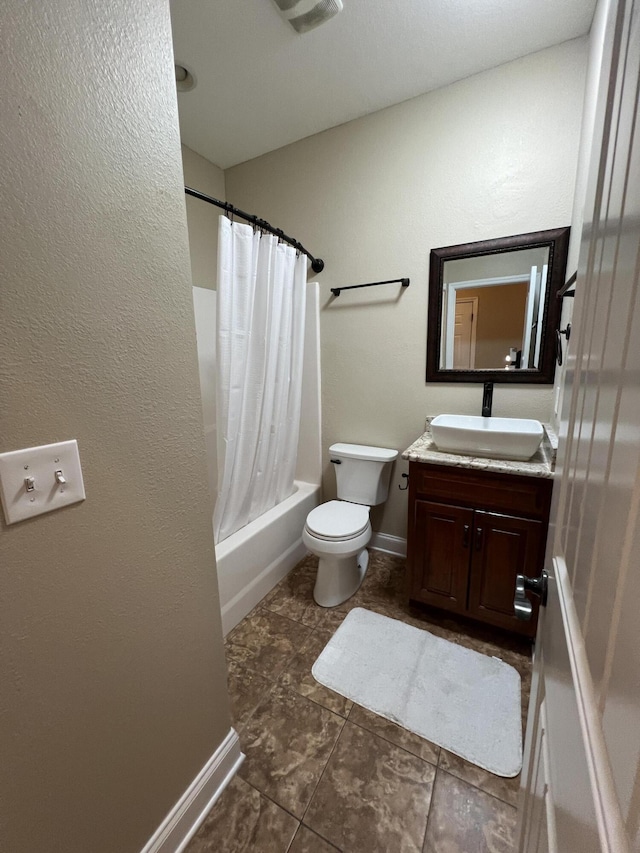 full bathroom featuring vanity, shower / bath combo, and toilet