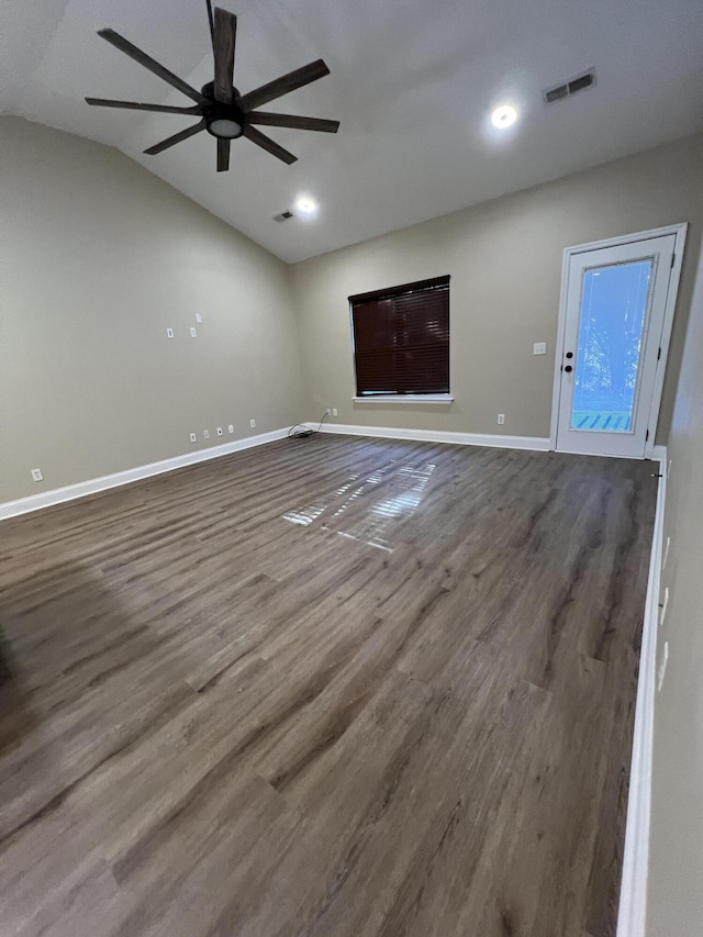 unfurnished living room featuring ceiling fan, wood-type flooring, and vaulted ceiling