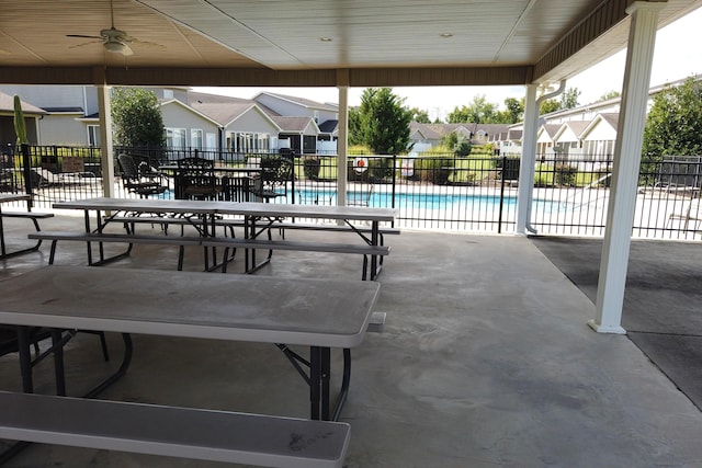 view of pool with ceiling fan and a patio area