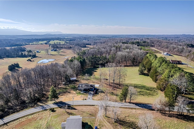 drone / aerial view with a mountain view and a rural view