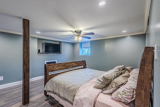 bedroom with crown molding, wood-type flooring, and ceiling fan