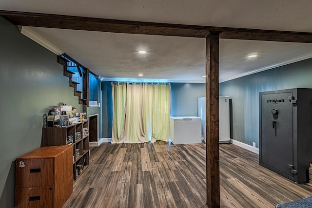 interior space with fridge, wood-type flooring, and ornamental molding