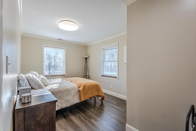 bedroom with ornamental molding and dark hardwood / wood-style floors