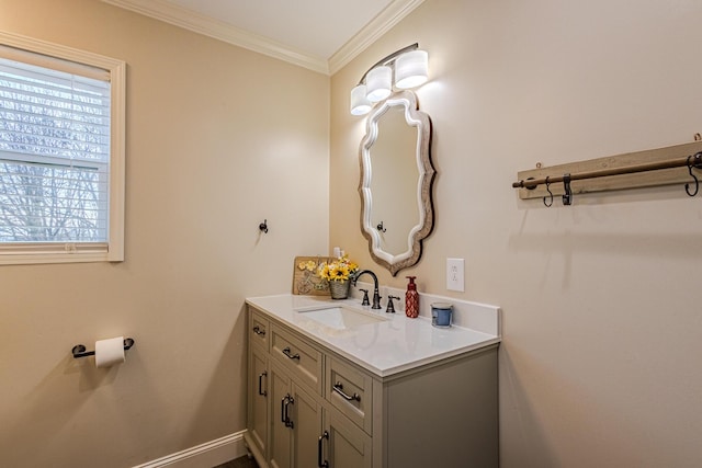 bathroom featuring crown molding and vanity