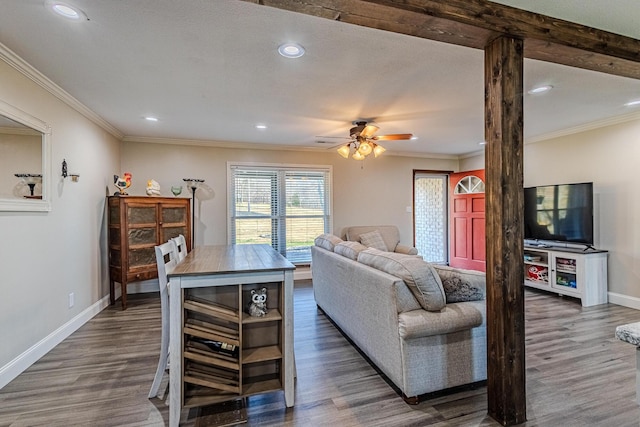 living room with ornamental molding and dark hardwood / wood-style flooring