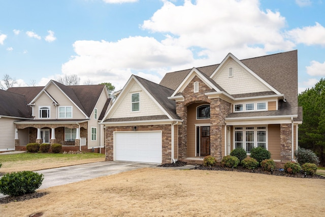 craftsman inspired home with a front yard and a porch