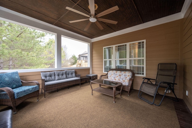 sunroom / solarium featuring ceiling fan and wooden ceiling