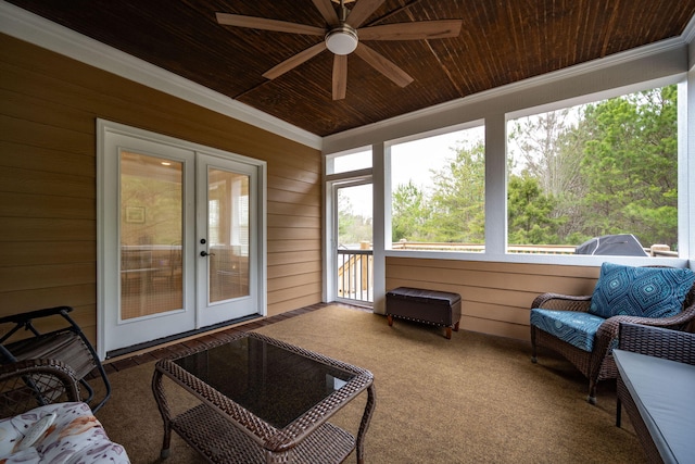 sunroom featuring french doors, ceiling fan, and wooden ceiling