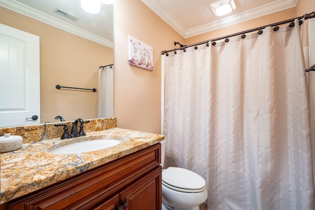 bathroom featuring vanity, ornamental molding, and toilet